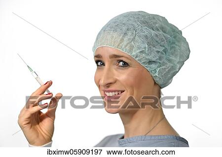 Symbol image Corona vaccine, doctor with syringe, corona crisis, Baden-Württemberg, Germany, Europe View Large Photo Image Stock Photo - Symbol image Corona vaccine, doctor with syringe, corona crisis, Baden-Württemberg, Germany, Europe. Fotosearch