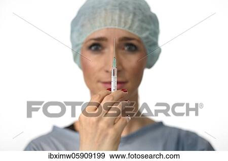 Symbol image Corona vaccine, doctor with syringe, corona crisis, Baden-Württemberg, Germany, Europe View Large Photo Image Stock Photo - Symbol image Corona vaccine, doctor with syringe, corona crisis, Baden-Württemberg, Germany, Europe. Fotosearch