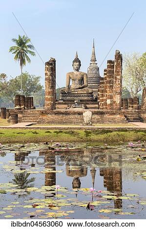 Temple Wat Mahathat Sukhothai, sitting Buddha, reflection in water lily tank, Sukhothai historical park, Sukhothai, Thailand, Asia View Large Photo Image Stock Image - Temple Wat Mahathat Sukhothai, sitting Buddha, reflection in water lily tank, Sukhothai historical park, Sukhothai, Thailand, Asia. Fotosearch