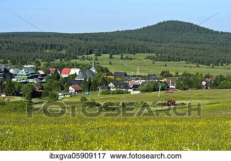 The village Boží Dar, Gottesgab, on the ridge of the Ore Mountains, in the background the mountain Božídarský Špicák, Gottesgaber Spitzberg, UNESCO World Heritage Site Ore Mountain Mining Region, Krušnohorí, Boží Dar, Bohemia, Czech Republic, Europe View Large Photo Image Stock Photo - The village Boží Dar, Gottesgab, on the ridge of the Ore Mountains, in the background the mountain Božídarský Špicák, Gottesgaber Spitzberg, UNESCO World Heritage Site Ore Mountain Mining Region, Krušnohorí, Boží Dar, Bohemia, Czech Republic, Europe. Fotosearch