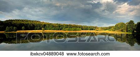 Stock Photo - Thunderclouds over pond, near Clausthal-Zellerfeld, Harz Mountains, Lower Saxony, Germany, Europe. Fotosearch