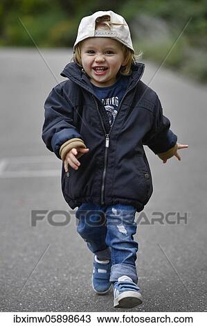 Stock Image - Toddler, boy, 2 years, running, Stuttgart, Baden-Württemberg, Germany, Europe. Fotosearch