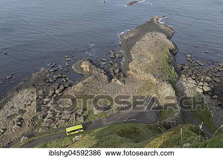 Stock Photograph - Tourists at the Basalt Columns, Giant's Causeway, Bushmills, County Antrim, Northern Ireland, United Kingdom, Europe. Fotosearch