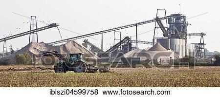 Tractor in front of gravel plant, Wesel, Niederrhein, Ruhr Area, North Rhine-Westphalia, Germany, Europe View Large Photo Image Stock Photo - Tractor in front of gravel plant, Wesel, Niederrhein, Ruhr Area, North Rhine-Westphalia, Germany, Europe. Fotosearch