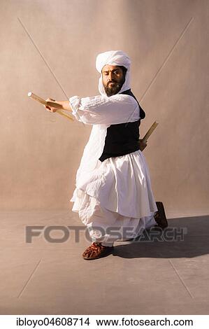 Traditional dances performed by Abdollah, Torbat-e Jam, between Mashhad and the Afghanistan Border, Iran, Asia View Large Photo Image Picture - Traditional dances performed by Abdollah, Torbat-e Jam, between Mashhad and the Afghanistan Border, Iran, Asia. Fotosearch