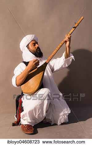 Traditional music performed by Abdollah, Torbat-e Jam, between Mashhad and the Afghanistan Border, Iran, Asia View Large Photo Image Stock Image - Traditional music performed by Abdollah, Torbat-e Jam, between Mashhad and the Afghanistan Border, Iran, Asia. Fotosearch