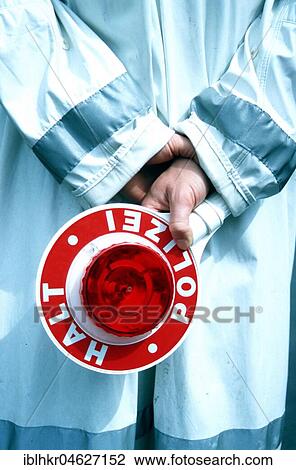 Stock Image - Traffic police officer with trowel, Berlin, Germany, Europe. Fotosearch