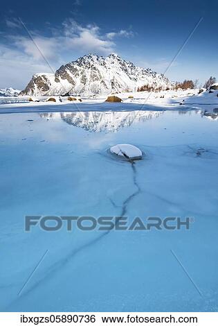 Turquoise lagoon with ice floes, behind it snow-covered mountains Sundklakktinden and Varden Anderstinden, Nordland, Lofoten, Norway, Europe View Large Photo Image Stock Photograph - Turquoise lagoon with ice floes, behind it snow-covered mountains Sundklakktinden and Varden Anderstinden, Nordland, Lofoten, Norway, Europe. Fotosearch