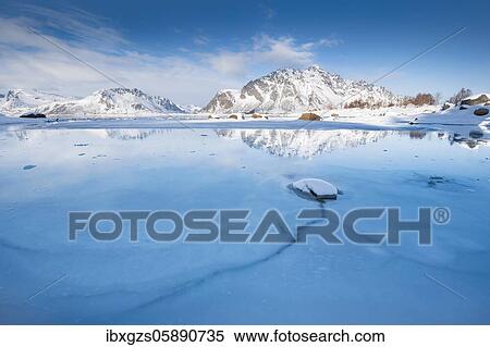 Turquoise lagoon with ice floes, behind it snow-covered mountains Sundklakktinden and Varden Anderstinden, Nordland, Lofoten, Norway, Europe View Large Photo Image Stock Photography - Turquoise lagoon with ice floes, behind it snow-covered mountains Sundklakktinden and Varden Anderstinden, Nordland, Lofoten, Norway, Europe. Fotosearch