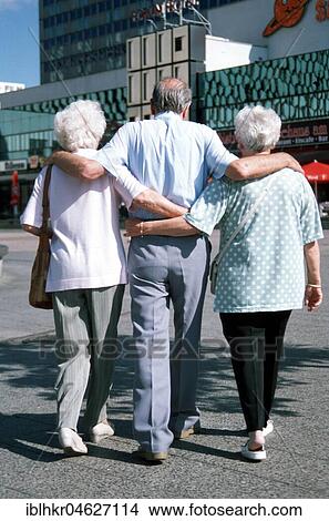 Picture - Two old ladies with old man, Berlin, Germany, Europe. Fotosearch