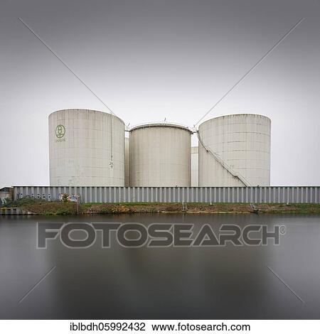 Stock Image - Unitank storage tanks for heating oil and diesel fuel at the Berlin Teltow Canal in Rudow, Berlin, Germany, Europe. Fotosearch