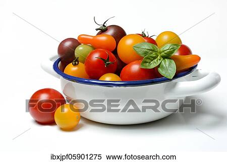 Stock Photography - Various cherry tomatoes in bowl, Germany, Europe. Fotosearch