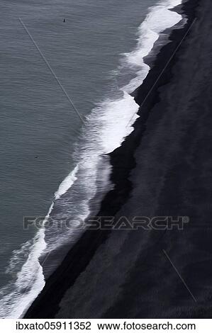 View from above on waves at the shore, black lava beach at the North Atlantic, motion blur, Cape Dyrhólaey, Vík í Mýrdal, Southern Iceland, Iceland, Europe View Large Photo Image Stock Image - View from above on waves at the shore, black lava beach at the North Atlantic, motion blur, Cape Dyrhólaey, Vík í Mýrdal, Southern Iceland, Iceland, Europe. Fotosearch