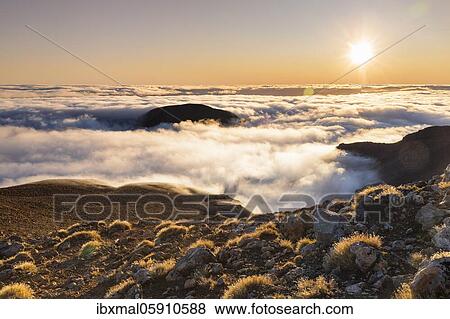 View from Mt. Ngauruhoe to Mt. Ruapehu at sunrise, Oceania, Tongariro National Park, UNESCO World Heritage Site, Ruapehu, North Island, New Zealand, Oceania View Large Photo Image Stock Photo - View from Mt. Ngauruhoe to Mt. Ruapehu at sunrise, Oceania, Tongariro National Park, UNESCO World Heritage Site, Ruapehu, North Island, New Zealand, Oceania. Fotosearch