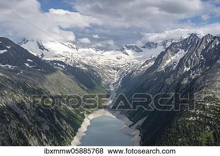 Stock Photo - View from the Berliner Höhenweg to the Schlegeis reservoir, Schlegeis reservoir, Zillertal Alps, Schlegeiskees glacier, Zillertal, Tyrol, Austria, Europe. Fotosearch