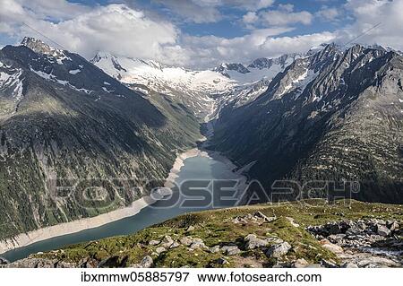 Stock Photo - View from the Berliner Höhenweg to the Schlegeis reservoir, Schlegeis reservoir, Zillertal Alps, Schlegeiskees glacier, Zillertal, Tyrol, Austria, Europe. Fotosearch