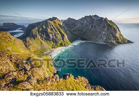 Stock Image - View from the summit to Kvalvika beach and wide sea, Ryten summit, Fredvang, Lofoten, Nordland, Norway, Europe. Fotosearch