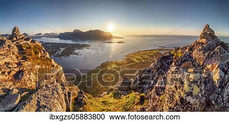 Stock Image - View from the top of Hoven into the sunset over the sea, Gimsøy, Lofoten, Nordland, Norway, Europe. Fotosearch