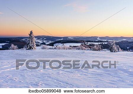 Stock Photo - View from Wasserkuppe in south direction in winter, dusk, nature park Park Hessian Rhön, Hesse, Germany, Europe. Fotosearch