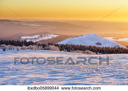View from Wasserkuppe in west direction in winter, sunset, nature park Park Hessian Rhön, Hesse, Germany, Europe View Large Photo Image Picture - View from Wasserkuppe in west direction in winter, sunset, nature park Park Hessian Rhön, Hesse, Germany, Europe. Fotosearch