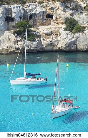 View of Cala Macarella and sailboats, Menorca, Balearic Islands, Spain, Europe View Large Photo Image Stock Photograph - View of Cala Macarella and sailboats, Menorca, Balearic Islands, Spain, Europe. Fotosearch