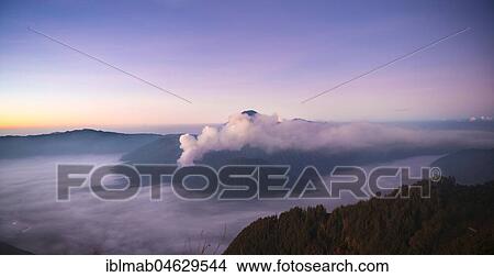 View of Caldera Tengger with volcanoes at sunrise, smoking volcano Gunung Bromo, with Mt. Batok, Mt. Kursi, Mt. Gunung Semeru, National Park Bromo-Tengger-Semeru, Java, Indonesia, Asia View Large Photo Image Picture - View of Caldera Tengger with volcanoes at sunrise, smoking volcano Gunung Bromo, with Mt. Batok, Mt. Kursi, Mt. Gunung Semeru, National Park Bromo-Tengger-Semeru, Java, Indonesia, Asia. Fotosearch