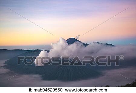 View of Caldera Tengger with volcanoes at sunrise, smoking volcano Gunung Bromo, with Mt. Batok, Mt. Kursi, Mt. Gunung Semeru, National Park Bromo-Tengger-Semeru, Java, Indonesia, Asia View Large Photo Image Stock Image - View of Caldera Tengger with volcanoes at sunrise, smoking volcano Gunung Bromo, with Mt. Batok, Mt. Kursi, Mt. Gunung Semeru, National Park Bromo-Tengger-Semeru, Java, Indonesia, Asia. Fotosearch