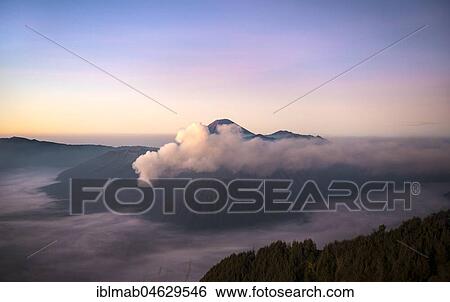 View of Caldera Tengger with volcanoes at sunrise, smoking volcano Gunung Bromo, with Mt. Batok, Mt. Kursi, Mt. Gunung Semeru, National Park Bromo-Tengger-Semeru, Java, Indonesia, Asia View Large Photo Image Stock Photograph - View of Caldera Tengger with volcanoes at sunrise, smoking volcano Gunung Bromo, with Mt. Batok, Mt. Kursi, Mt. Gunung Semeru, National Park Bromo-Tengger-Semeru, Java, Indonesia, Asia. Fotosearch