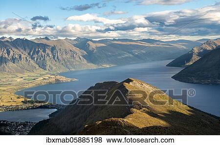 Stock Photo - View of Lake Wakatipu, Ben Lomond, Southern Alps, Otago, South Island, New Zealand, Oceania. Fotosearch
