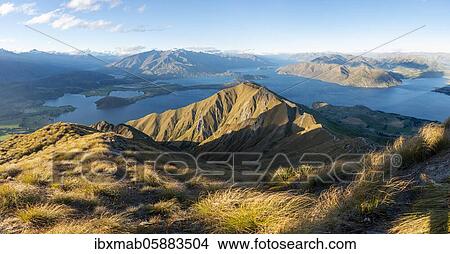 View of mountains and lake from Mount Roy, Roys Peak at sunset, Lake Wanaka, Southern Alps, Otago, South Island, New Zealand, Oceania View Large Photo Image Picture - View of mountains and lake from Mount Roy, Roys Peak at sunset, Lake Wanaka, Southern Alps, Otago, South Island, New Zealand, Oceania. Fotosearch