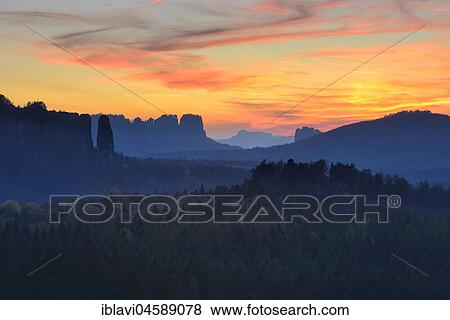 View of rocks and forests at sunset, on the left the Bloßstock, Elbsandsteingebirge, National Park Saxon Switzerland, Saxony, Germany, Europe View Large Photo Image Stock Photo - View of rocks and forests at sunset, on the left the Bloßstock, Elbsandsteingebirge, National Park Saxon Switzerland, Saxony, Germany, Europe. Fotosearch