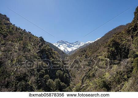 Stock Photograph - View of snow-covered mountains of the Sierra Nevada with summits Mulhacén and La Alcazaba, Andalusia, Spain, Europe. Fotosearch