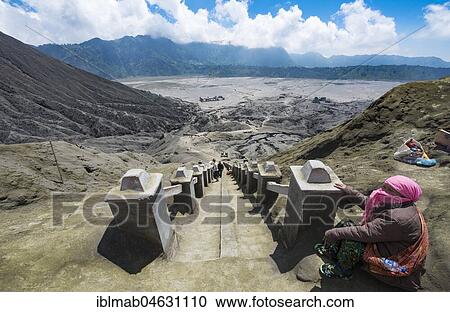 View of the Tengger Caldera, local woman sitting on the stairs at the edge of the crater of Gunung Bromo, National Park Bromo-Tengger-Semeru, Java, Indonesia, Asia View Large Photo Image Stock Image - View of the Tengger Caldera, local woman sitting on the stairs at the edge of the crater of Gunung Bromo, National Park Bromo-Tengger-Semeru, Java, Indonesia, Asia. Fotosearch