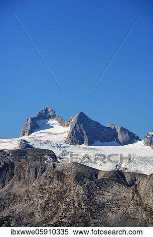 Stock Photography - View to the Hallstatt Glacier and High Dachstein, Dachstein massif, Krippenstein, Obertraun, Salzkammergut, Upper Austria, Austria, Europe. Fotosearch