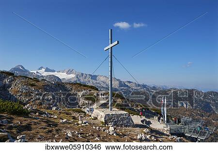 Stock Photograph - Viewpoint Five Fingers with pioneer cross, and High Dachstein, Dachstein massif, Krippenstein, Obertraun, Salzkammergut, Upper Austria, Austria, Europe. Fotosearch