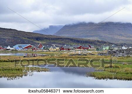 Village view with typical colourful painted houses, in front small pond, Qeqertarsuaq, disco island, disco bay, Greenland, North America View Large Photo Image Stock Image - Village view with typical colourful painted houses, in front small pond, Qeqertarsuaq, disco island, disco bay, Greenland, North America. Fotosearch