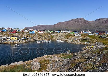 Village view with typical colourful painted houses, in front bay with small boats, Qeqertarsuaq, disco island, disco bay, Greenland, North America View Large Photo Image Stock Photo - Village view with typical colourful painted houses, in front bay with small boats, Qeqertarsuaq, disco island, disco bay, Greenland, North America. Fotosearch