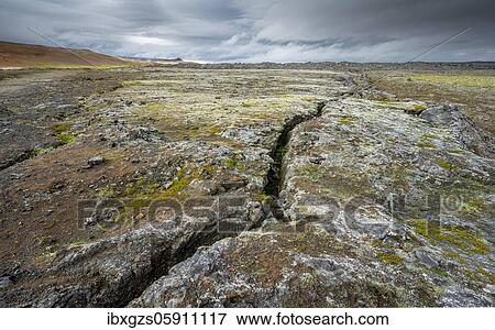 Stock Photo - Volcanic fissure Grjótagjá with coloured moss in the Krafla, Skútustaðir, Norðurland eystra, Iceland, Europe. Fotosearch