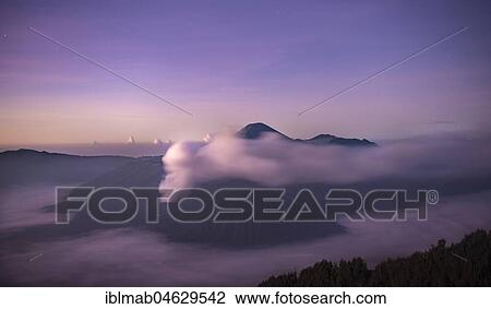 Volcanic landscape at sunrise with starry sky, smoking volcano Gunung Bromo, with Mt. Batok, Mt. Kursi, Mt. Gunung Semeru, National Park Bromo-Tengger-Semeru, Java, Indonesia, Asia View Large Photo Image Stock Image - Volcanic landscape at sunrise with starry sky, smoking volcano Gunung Bromo, with Mt. Batok, Mt. Kursi, Mt. Gunung Semeru, National Park Bromo-Tengger-Semeru, Java, Indonesia, Asia. Fotosearch