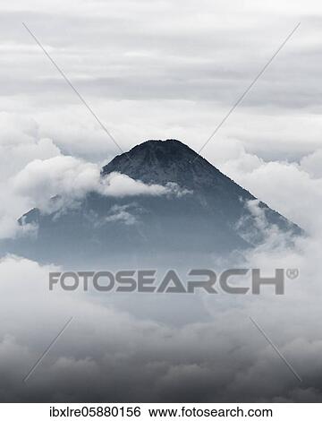 Stock Photograph - Volcano surrounded by clouds, Volcan Pacaya, Guatemala, Central America. Fotosearch