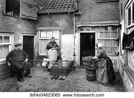 Washing laundry in the courtyard ca. 1930, exact place unknown, Germany, Europe View Large Photo Image Stock Photography - Washing laundry in the courtyard ca. 1930, exact place unknown, Germany, Europe. Fotosearch