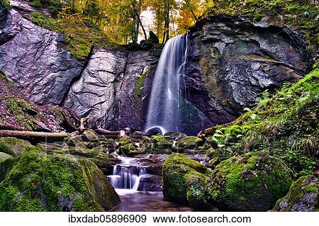 Waterfall in autumn forest, Finstersee, Canton Zug, Switzerland, Europe View Large Photo Image Stock Photo - Waterfall in autumn forest, Finstersee, Canton Zug, Switzerland, Europe. Fotosearch