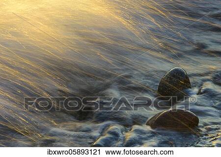 Waves and spray on the beach at sunrise, wave movements at the foot of the chalk cliffs, Baltic Sea, Saßnitz, Rügen, Jasmund National Park, Mecklenburg-Vorpommern, Germany, Europe View Large Photo Image Stock Image - Waves and spray on the beach at sunrise, wave movements at the foot of the chalk cliffs, Baltic Sea, Saßnitz, Rügen, Jasmund National Park, Mecklenburg-Vorpommern, Germany, Europe. Fotosearch