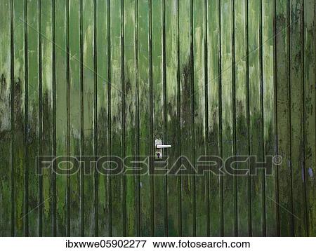 Stock Photo - Weathered green garage door, Strobl am Wolfgangsee, Salzkammergut, Upper Austria, Austria, Europe. Fotosearch