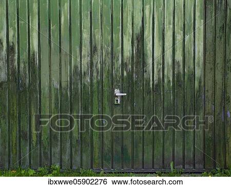 Stock Photograph - Weathered green garage door, Strobl am Wolfgangsee, Salzkammergut, Upper Austria, Austria, Europe. Fotosearch