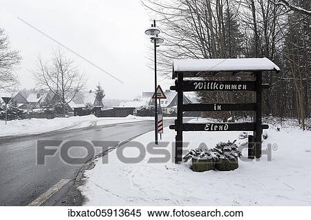 Welcome sign made of wood at the entrance of the village, Welcome to Elend, dreary winter weather, district Elend, Oberharz am Brocken, district Harz, Saxony-Anhalt, Germany, Europe View Large Photo Image Stock Photography - Welcome sign made of wood at the entrance of the village, Welcome to Elend, dreary winter weather, district Elend, Oberharz am Brocken, district Harz, Saxony-Anhalt, Germany, Europe. Fotosearch