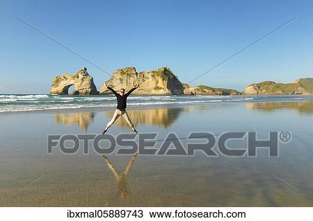 Wharariki Beach at sunset, Oceania, Golden Bay, Tasman, South Island, New Zealand, Oceania View Large Photo Image Stock Image - Wharariki Beach at sunset, Oceania, Golden Bay, Tasman, South Island, New Zealand, Oceania. Fotosearch