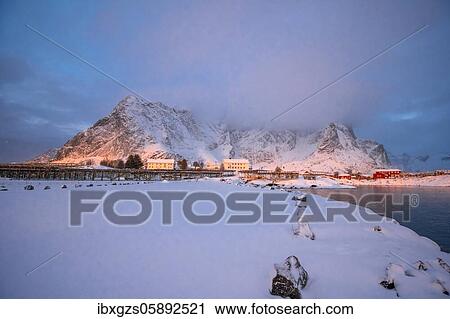 Winter atmosphere early in the morning in the fishing village, stockfish racks, snowfall in the mountains, Reine, Nordland, Lofoten, Norway, Europe View Large Photo Image Stock Image - Winter atmosphere early in the morning in the fishing village, stockfish racks, snowfall in the mountains, Reine, Nordland, Lofoten, Norway, Europe. Fotosearch