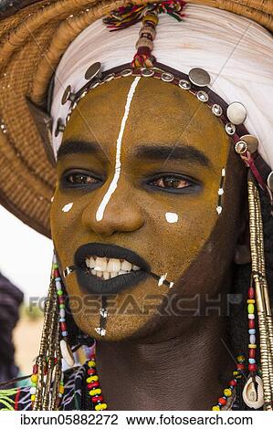 Wodaabe-Bororo man with face painted at the annual Gerewol festival, courtship ritual competition among the Fulani ethnic group, Niger, Africa View Large Photo Image Stock Image - Wodaabe-Bororo man with face painted at the annual Gerewol festival, courtship ritual competition among the Fulani ethnic group, Niger, Africa. Fotosearch