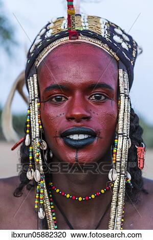Wodaabe-Bororo man with face painted at the annual Gerewol festival, courtship ritual competition among the Fulani ethnic group, Niger, Africa View Large Photo Image Stock Image - Wodaabe-Bororo man with face painted at the annual Gerewol festival, courtship ritual competition among the Fulani ethnic group, Niger, Africa. Fotosearch